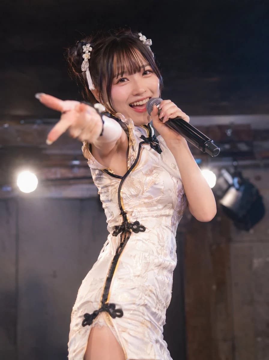 Realistic concert portrait of a smiling idol singer in a white qipao-inspired stage outfit
