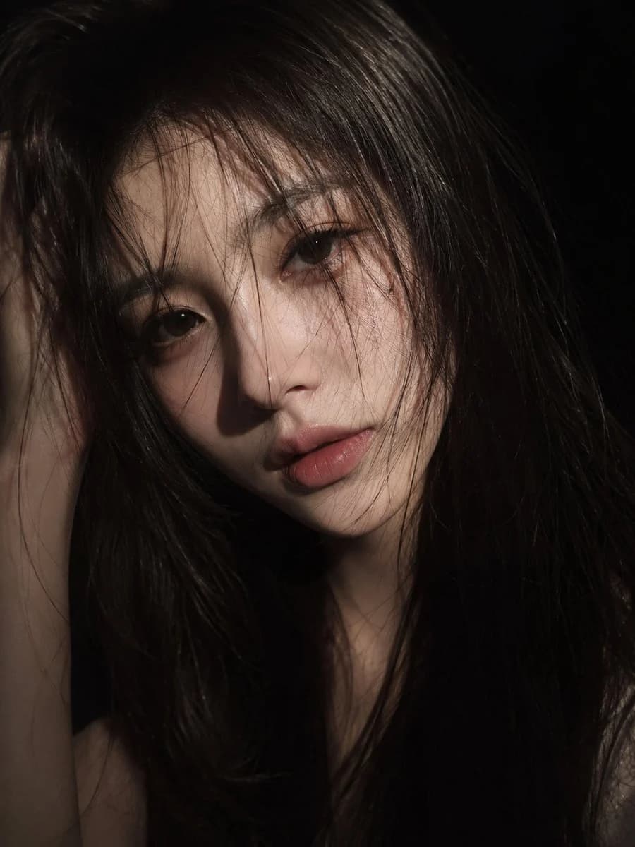 Cinematic Melancholic Female Portrait with expressive portrait lighting, detailed styling and a polished editorial mood