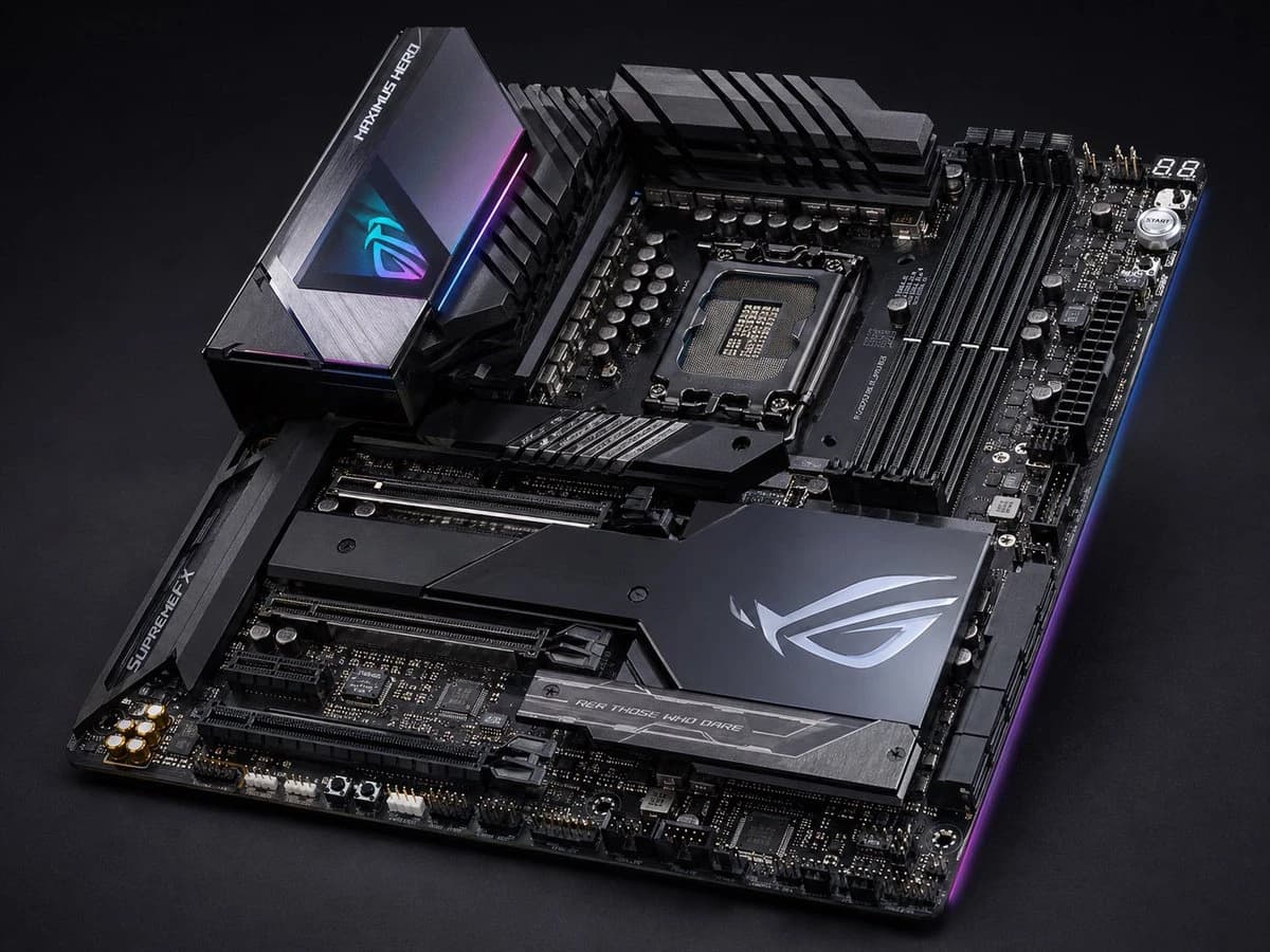 A high-end ATX gaming motherboard features a matte black and gunmetal design with RGB lighting, showcasing an Intel CPU socket and multiple PCIe slots
