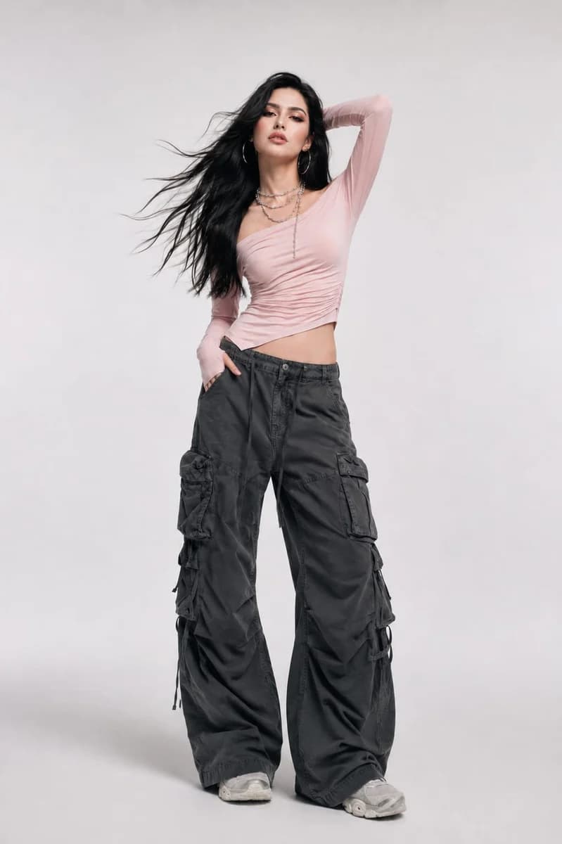 High-fashion studio portrait of a woman in contemporary streetwear with clean lighting and editorial styling