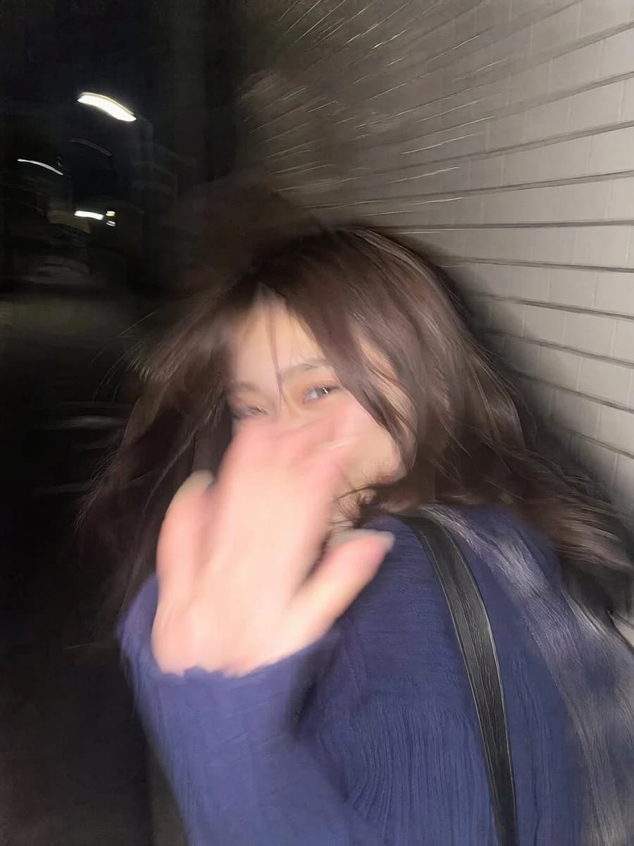 Tokyo sidewalk snapshot with motion blur, street portrait framing, and candid urban night photography mood